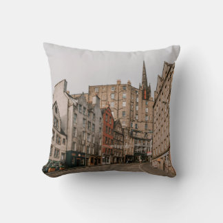 CARS PARKED BESIDE BROWN CONCRETE BUILDING DURING CUSHION