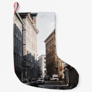 CARS PARKED ON SIDE OF THE ROAD IN BETWEEN BUILDIN SMALL CHRISTMAS STOCKING