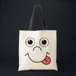 Cartoon face tote bag<br><div class="desc">Funny smiling cartoon face with tongue out</div>