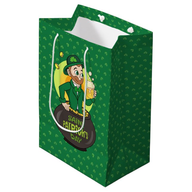 Cartoon leprechaun in a pot of gold holding a pint medium gift bag (Front Angled)