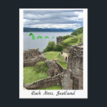Cartoon Loch Ness Monster & Urquhart Castle Funny Postcard<br><div class="desc">Cute cartoon Nessie (the Loch Ness Monster),  a light green dragon-like cartoon lake monster with smile swimming within a photograph of Loch Ness,  in the Scottish Highlands,  with Urquhart castle in the foreground. A funny postcard featuring beautiful Scotland scenery. Art and photograph by Letizia Morley.</div>