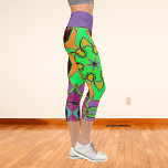 Cartoon Mandala Flower Green Orange and Purple Capri Leggings<br><div class="desc">This funky mandala flower design features green,  orange,  and purple in a cartoon style. Trippy geometric visuals for the modern hippie or lover of vibrant colours!</div>