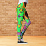 Cartoon Mandala Flower Green Orange and Purple Leggings<br><div class="desc">This funky mandala flower design features green,  orange,  and purple in a cartoon style. Trippy geometric visuals for the modern hippie or lover of vibrant colours!</div>