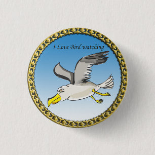 Cartoon seagull flying over head with a gold frame 3 cm round badge