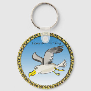 Cartoon seagull flying over head with a gold frame key ring