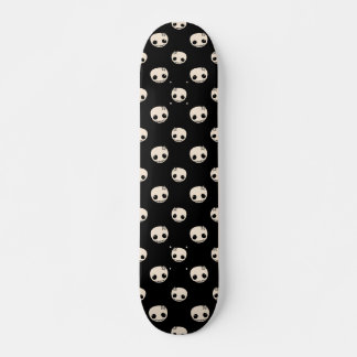 Cartoon Skulls with Star Bow on Black Background Skateboard
