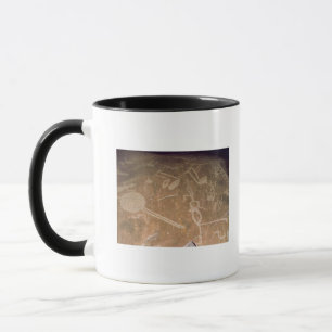 Carved petroglyph depicting figures mug