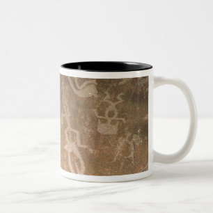 Carved petroglyph depicting figures Two-Tone coffee mug