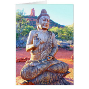 carved wood buddha meditating