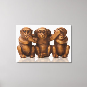 Carving of three wooden monkeys canvas print