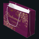 Cassis Purple & Gold Lace Elegant Bridesmaid Large Gift Bag<br><div class="desc">This beautiful gift bag is designed as a wedding gift or favour bag for Bridesmaids. It features an elegant cassis purple, magenta, or berry and gold design with golden lace frills in the corners the text "Bridesmaid" as well as a place to enter her name, the couple's name, and the...</div>
