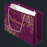 Cassis Purple & Gold Lace Elegant Bridesmaid Large Gift Bag<br><div class="desc">This beautiful gift bag is designed as a wedding gift or favour bag for Bridesmaids. It features an elegant cassis purple, magenta, or berry and gold design with golden lace frills in the corners the text "Bridesmaid" as well as a place to enter her name, the couple's name, and the...</div>