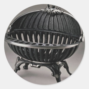 Cast iron fire basket, oval design classic round sticker