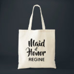 Casual Script Maid of Honour Monogram Favour Tote Bag<br><div class="desc">Trend typography monogram tote bag. Modern and stylish, this custom design features the text "Maid of Honour" in casual script lettering and an editable text field for a name in elegant sans serif in black. Easily personalise this design to match your style by clicking "Customise" to go to the design...</div>
