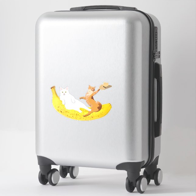 Cat chilling on banana holding hat (Suitcase)