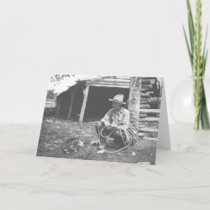 Cat eating out of a coffee can. card