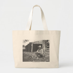 Cat eating out of a coffee can. large tote bag