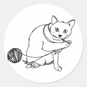 Cat eating / playing with a ball of string yarn classic round sticker