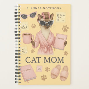 Cat female is holding daily planner