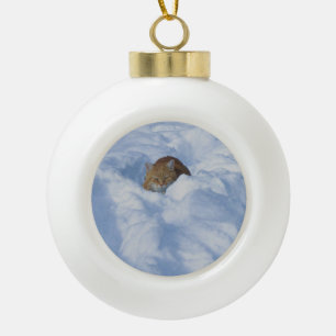 Cat in the snow ceramic ball christmas ornament