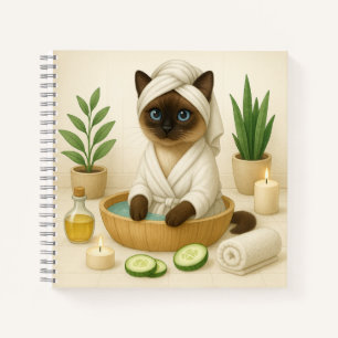 Cat is in spa with candle light notebook