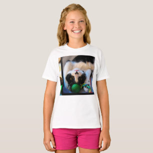 Cat is lying on the bed T-Shirt
