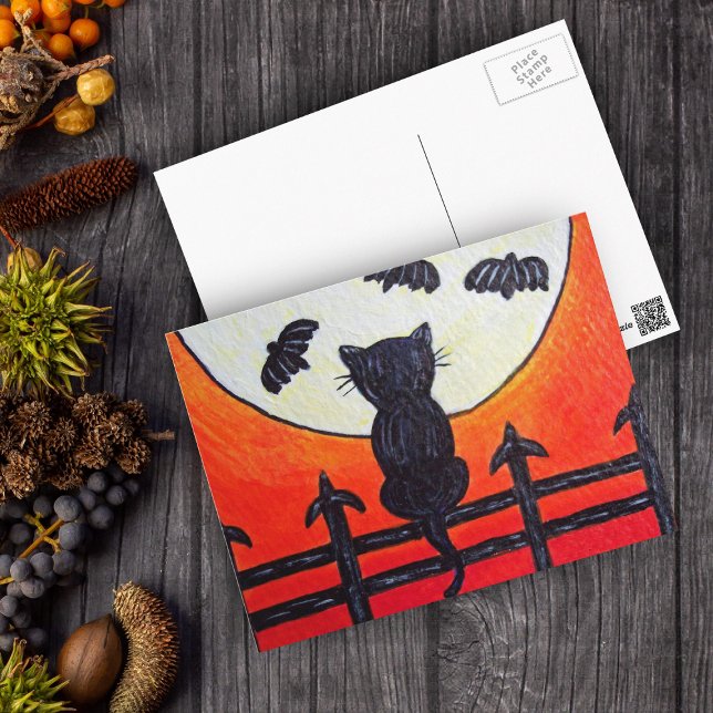 Cat On a Fence In The Moon Bats Postcard (Silhouette black cat on fence watching fly bats in full moon on orange Halloween postcard.)