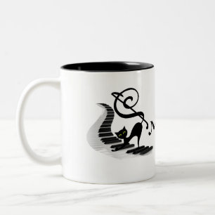 Cat on a Piano keyboard playing music coffee mug