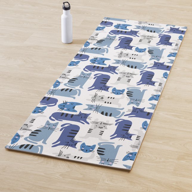 Cat Pattern Yoga Mat (A yoga mat with a pattern of blue and gray cats on a white background, next to a white-water bottle.)