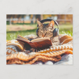 Cat reading book on knitted blanket holiday postcard