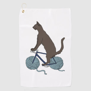 cat riding bike with yarn ball wheels golf towel