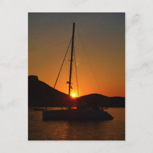 Catamaran at sunset Ibiza. Postcard