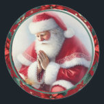 Catholic Christmas Santa with Rosary Poinsettias Classic Round Sticker<br><div class="desc">This beautiful traditional Catholic Christmas sticker features Santa Claus kneeling in prayer, holding a rosary, surrounded by vibrant poinsettias on a festive green background. The touching image combines the joyful spirit of Christmas with the reverence of prayer, reminding us of the deeper meaning of the season. Perfect for adding a...</div>