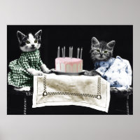 Cats celebrating a birthday with cake and candles