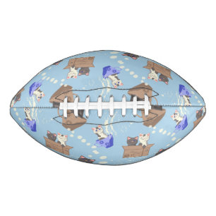 Cats in box and milk drops on blue american football