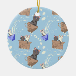 Cats in box and milk drops on blue ceramic tree decoration