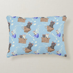 Cats in box and milk drops on blue decorative cushion