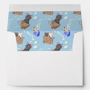 Cats in box and milk drops on blue envelope