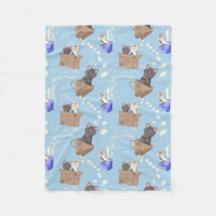 Cats in box and milk drops on blue fleece blanket