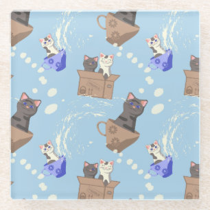 Cats in box and milk drops on blue glass coaster