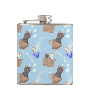 Cats in box and milk drops on blue hip flask
