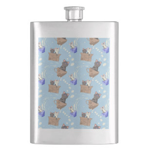 Cats in box and milk drops on blue hip flask