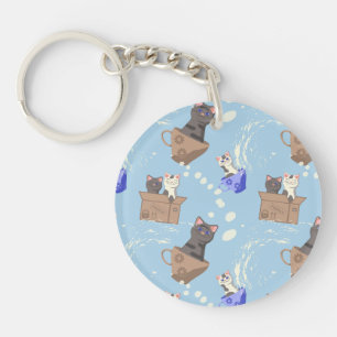 Cats in box and milk drops on blue key ring