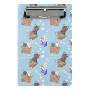 Cats in box and milk drops on blue mini clipboard