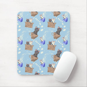 Cats in box and milk drops on blue mouse mat