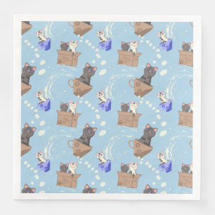 Cats in box and milk drops on blue napkin