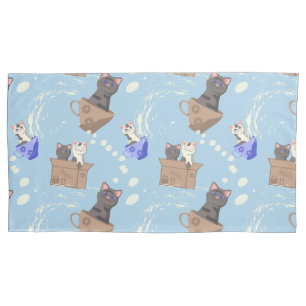Cats in box and milk drops on blue pillowcase
