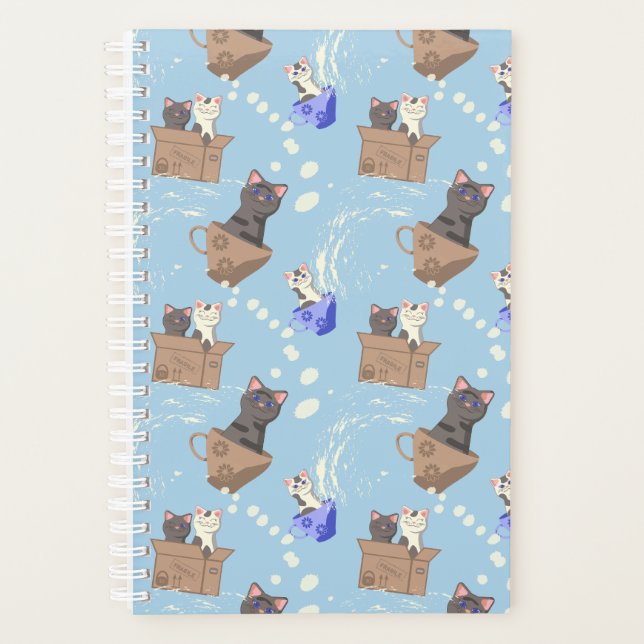 Cats in box and milk drops on blue planner (Front)