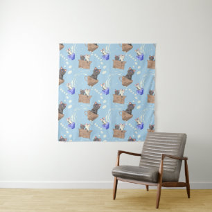 Cats in box and milk drops on blue tapestry