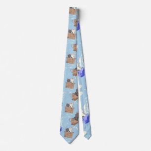 Cats in box and milk drops on blue tie